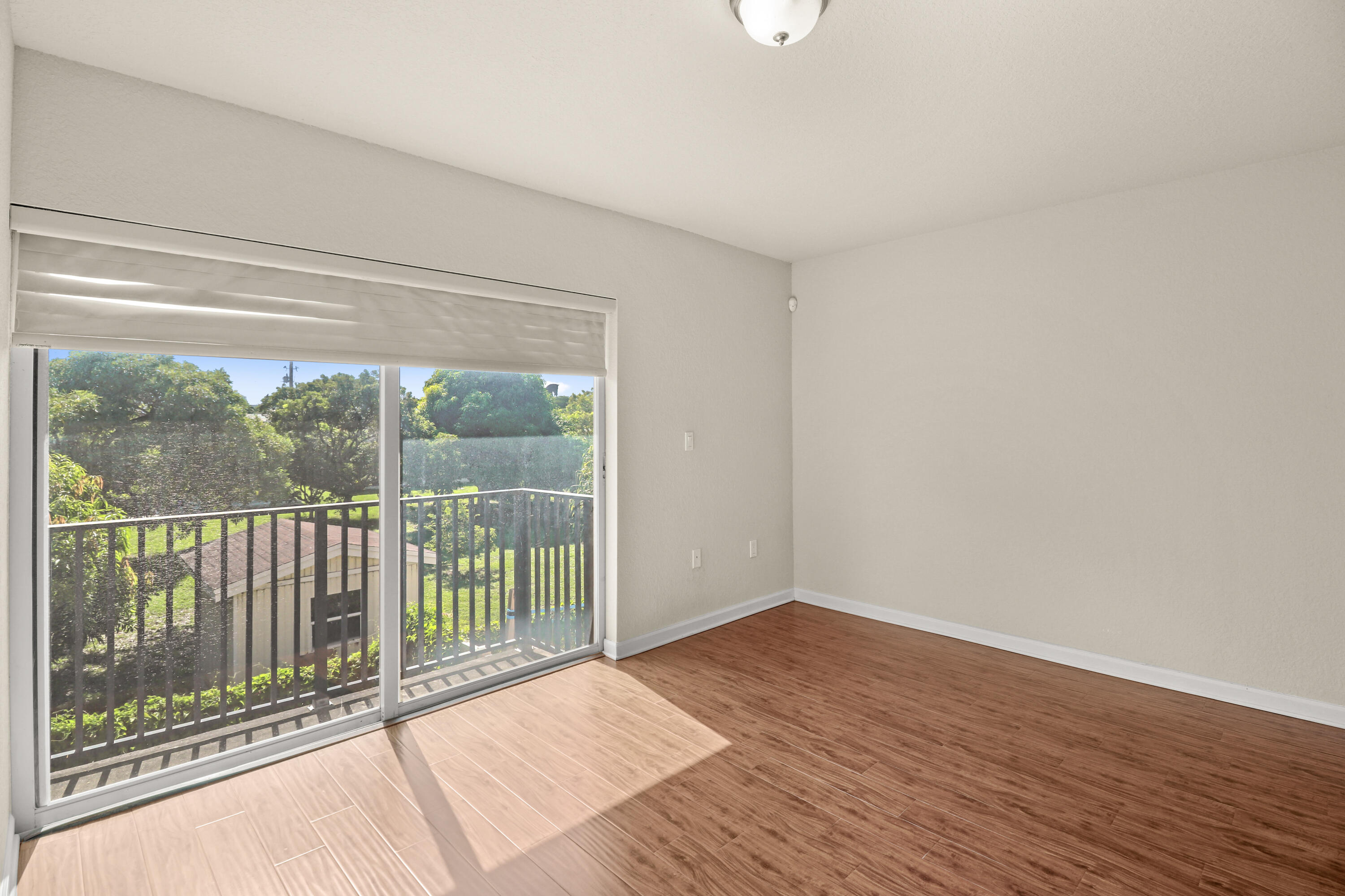 37 Southeast 3rd Avenue Hallandale Beach, FL 33009 - Photo 26 of 47 a view of a room with wooden floor and a window