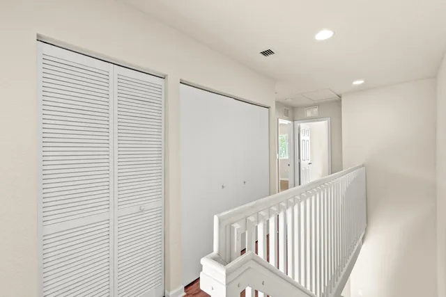 a view of a hallway with windows