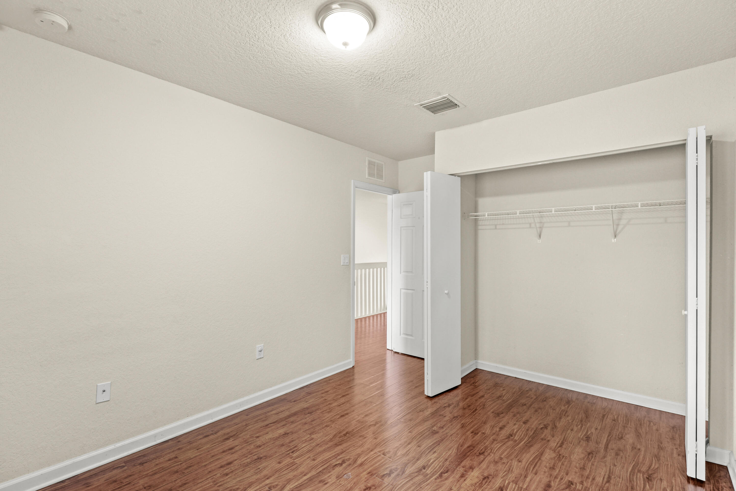 37 Southeast 3rd Avenue Hallandale Beach, FL 33009 - Photo 39 of 47 a view of an empty room with wooden floor