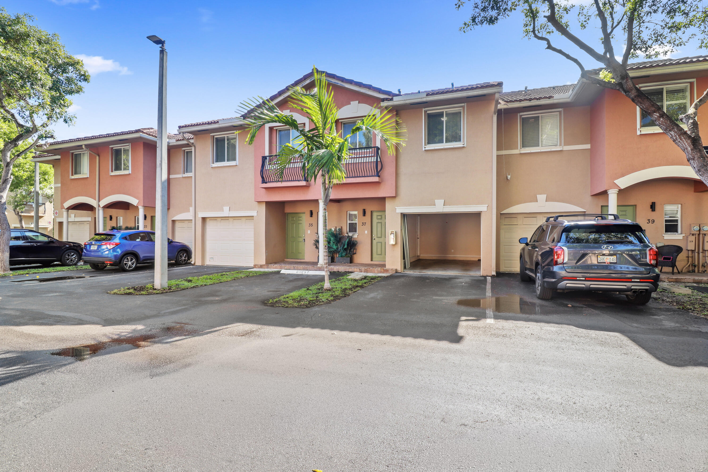 37 Southeast 3rd Avenue Hallandale Beach, FL 33009 - Photo 4 of 47 a car parked in front of a house