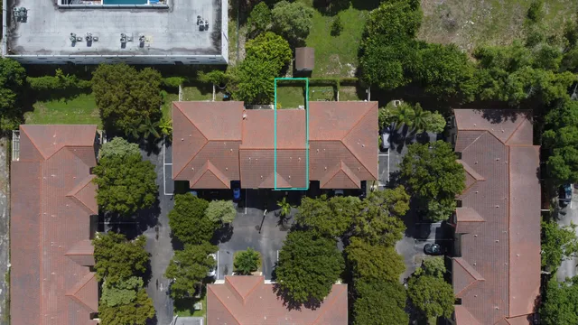 an aerial view of a house with outdoor space and street view