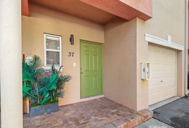 a view of a hallway with potted plants