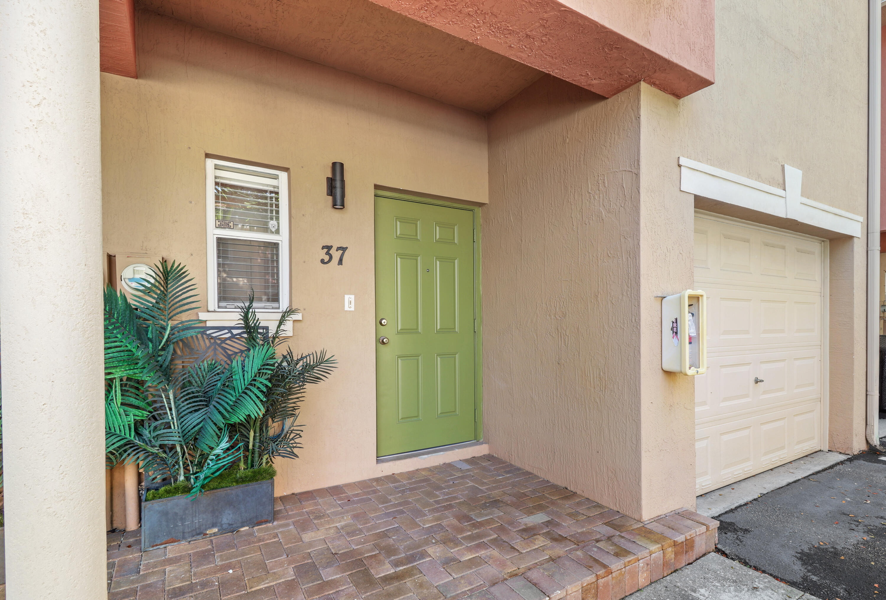37 Southeast 3rd Avenue Hallandale Beach, FL 33009 - Photo 6 of 47 a view of a hallway with potted plants