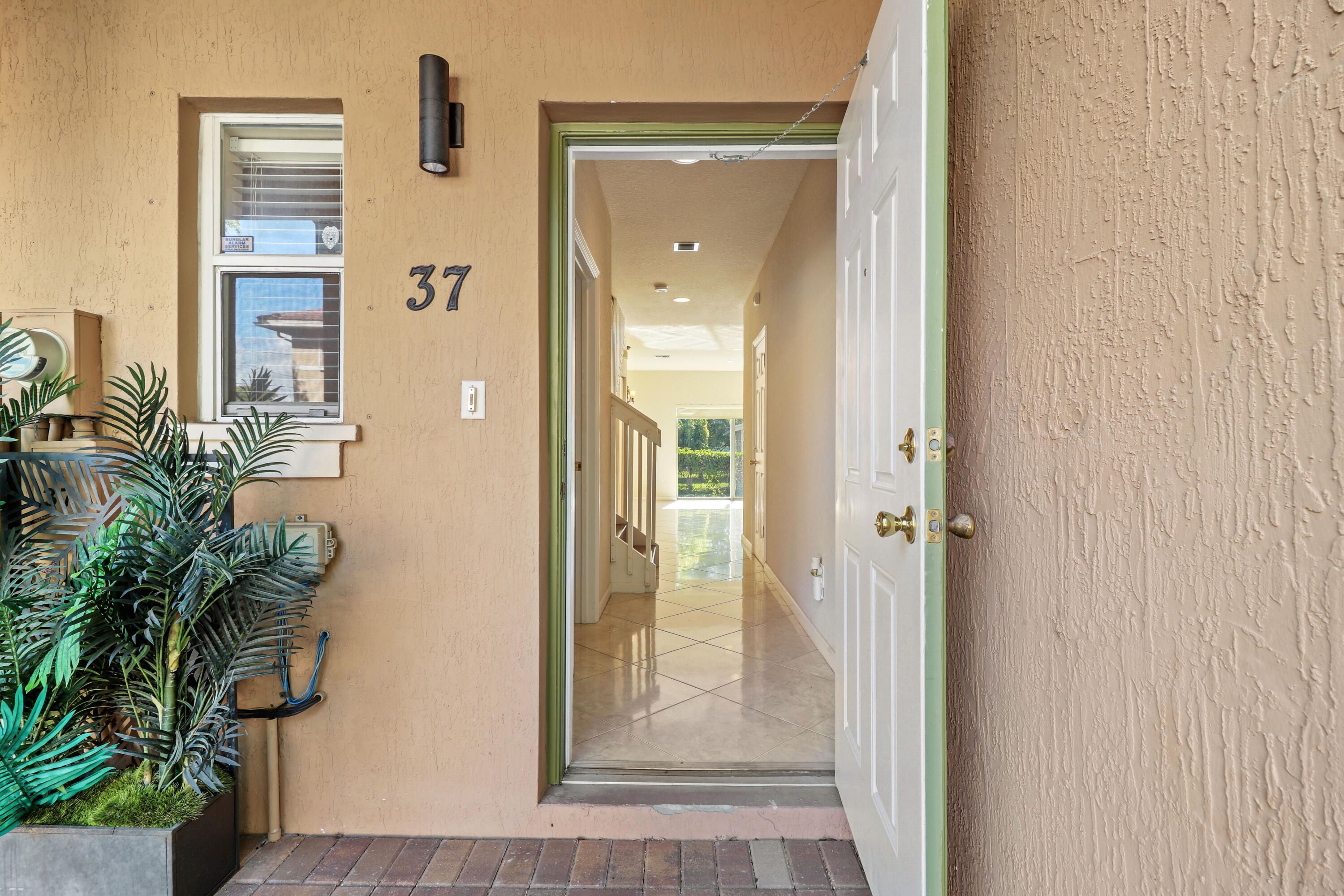 37 Southeast 3rd Avenue Hallandale Beach, FL 33009 - Photo 7 of 47 a view of a hallway with wooden floor and a potted plant