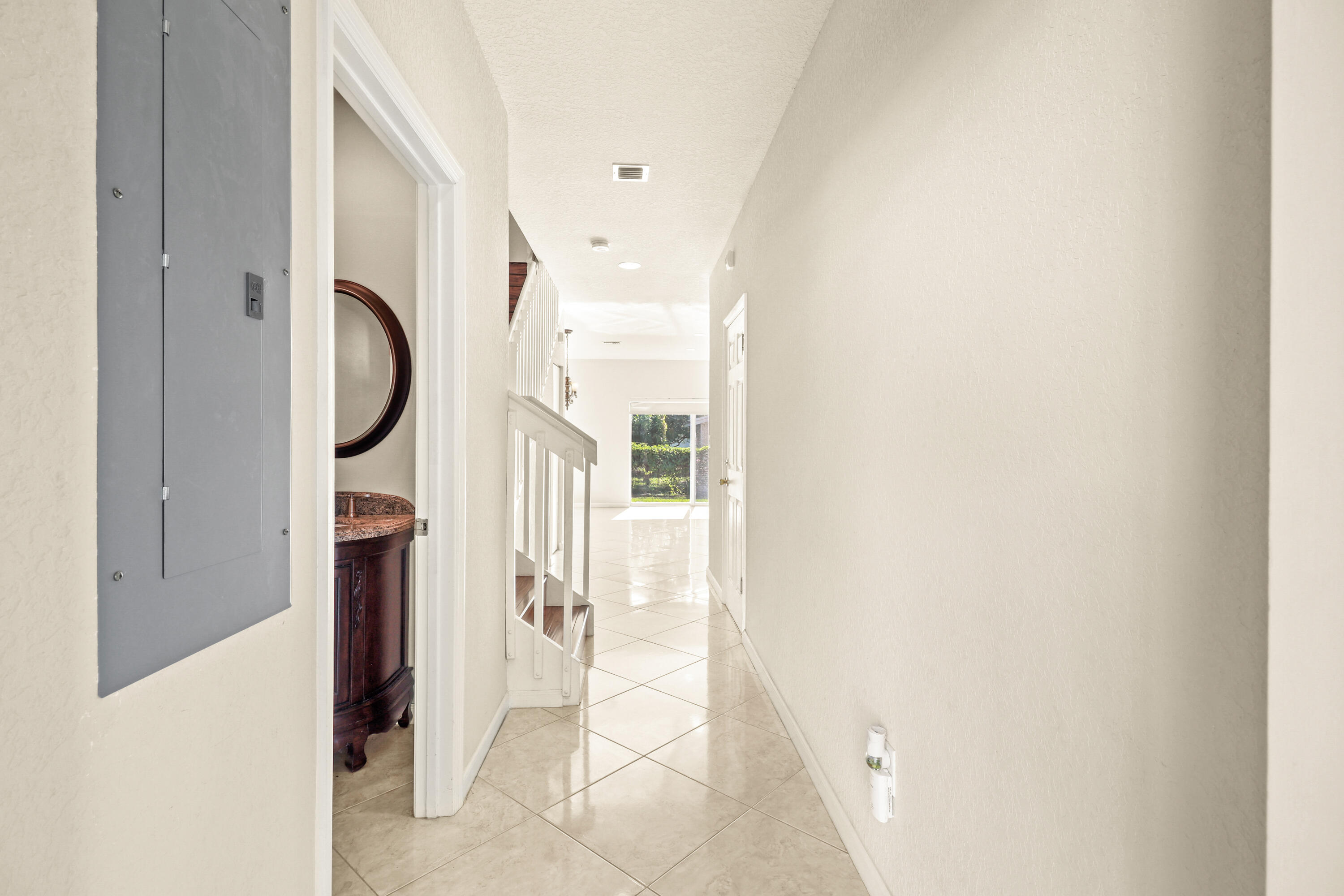 37 Southeast 3rd Avenue Hallandale Beach, FL 33009 - Photo 8 of 47 a view of an entryway with staircase