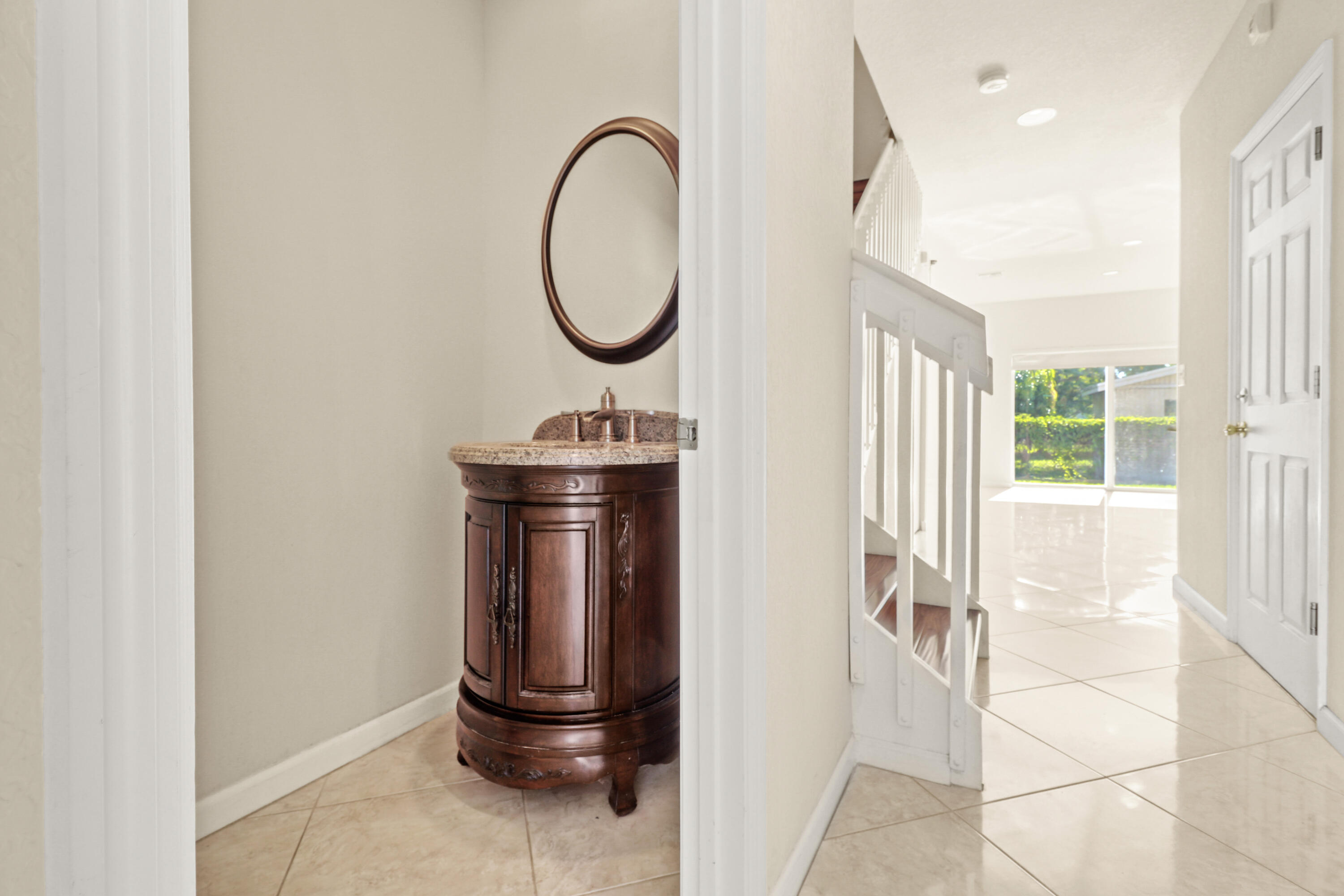 37 Southeast 3rd Avenue Hallandale Beach, FL 33009 - Photo 9 of 47 a front view of a house with entryway