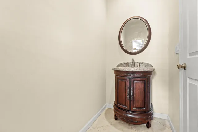 a room with a mirror and a wooden floor