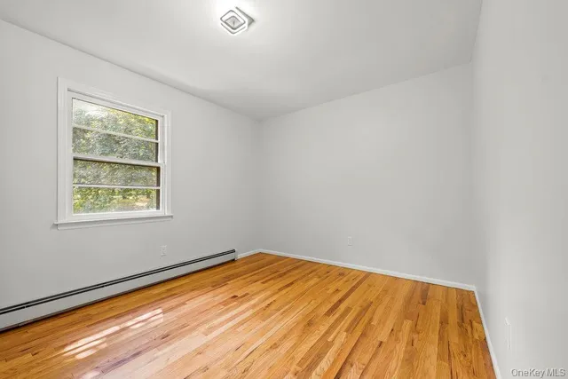 a view of balcony with wooden floor