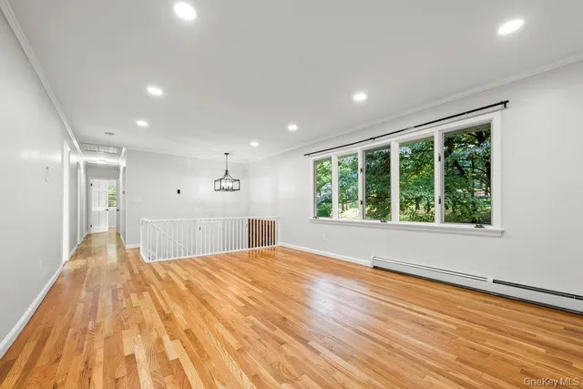 a view of a house with a yard balcony and sitting area
