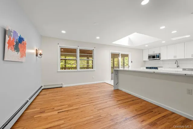 a kitchen with stainless steel appliances granite countertop a stove a refrigerator and a sink