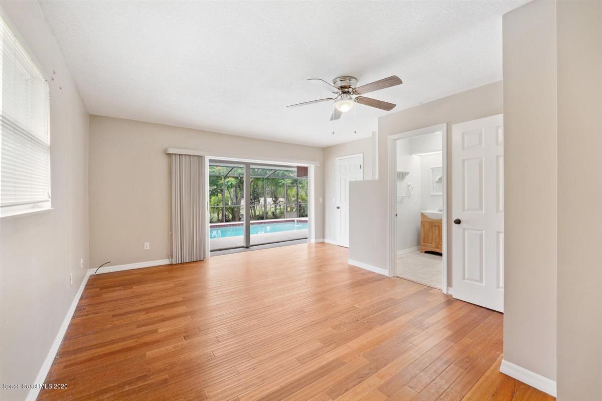 3600 Leghorn Road Grant Valkaria, FL 32950 - Photo 13 of 33 a view of empty room with wooden floor and fan