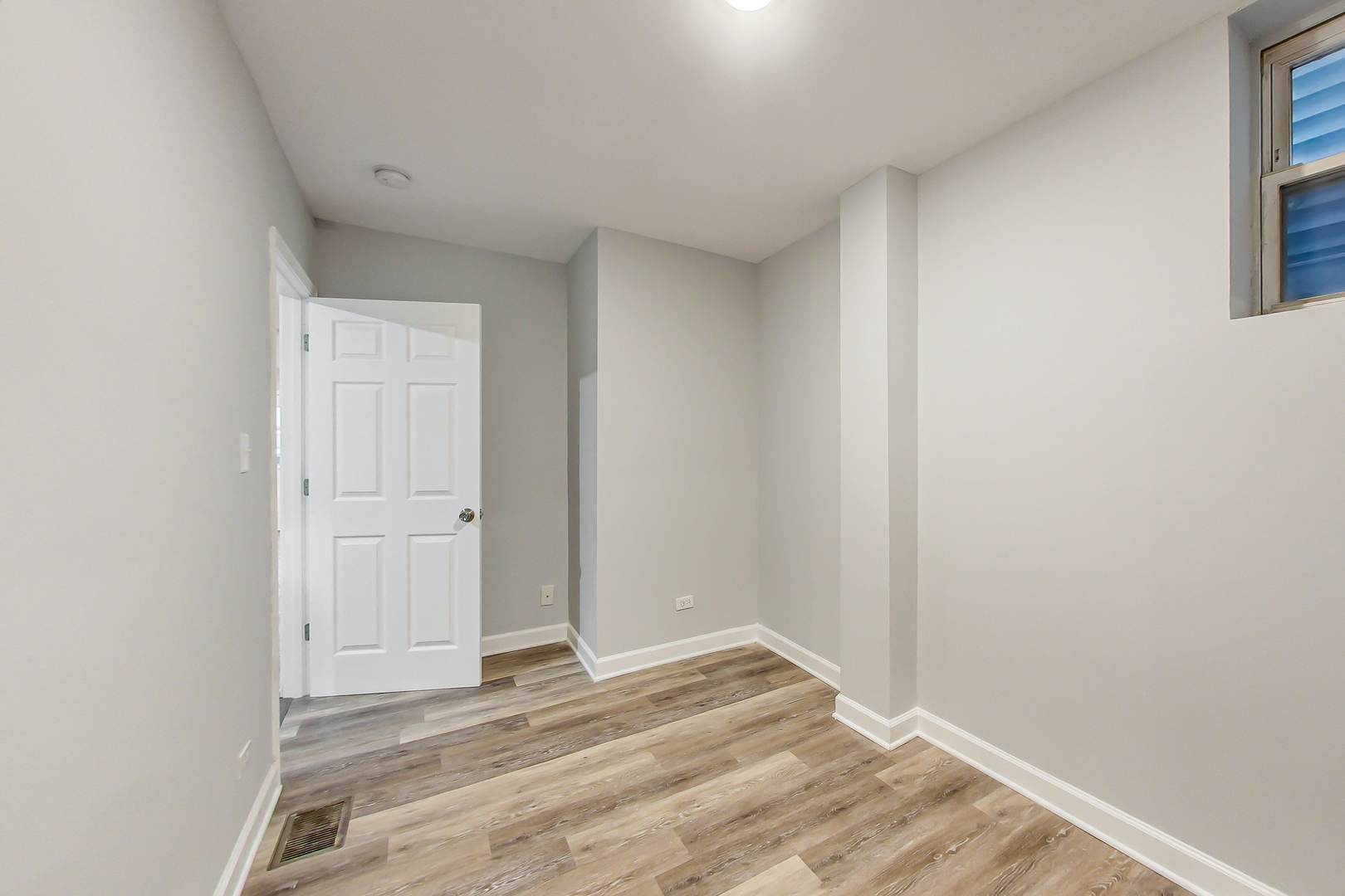 2338 West 18th Place Chicago, IL 60608 - Photo 11 of 63 a view of a room with wooden floor and closet