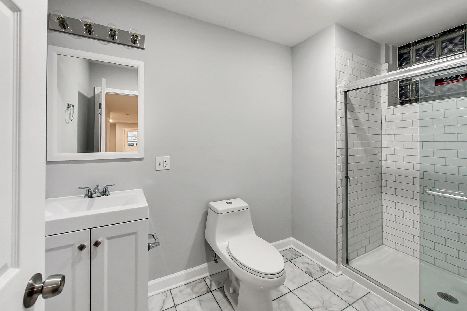 2338 West 18th Place Chicago, IL 60608 - Photo 15 of 63 a bathroom with a toilet sink and shower