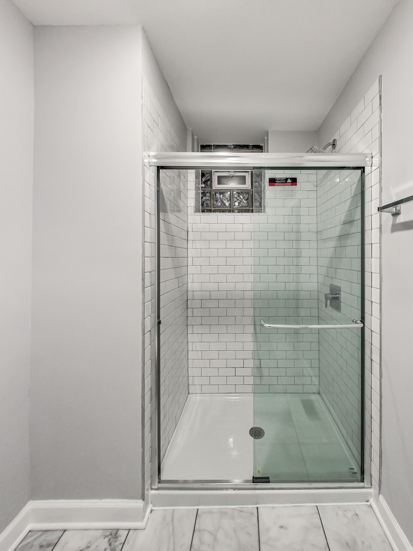 2338 West 18th Place Chicago, IL 60608 - Photo 16 of 63 a bathroom with a shower