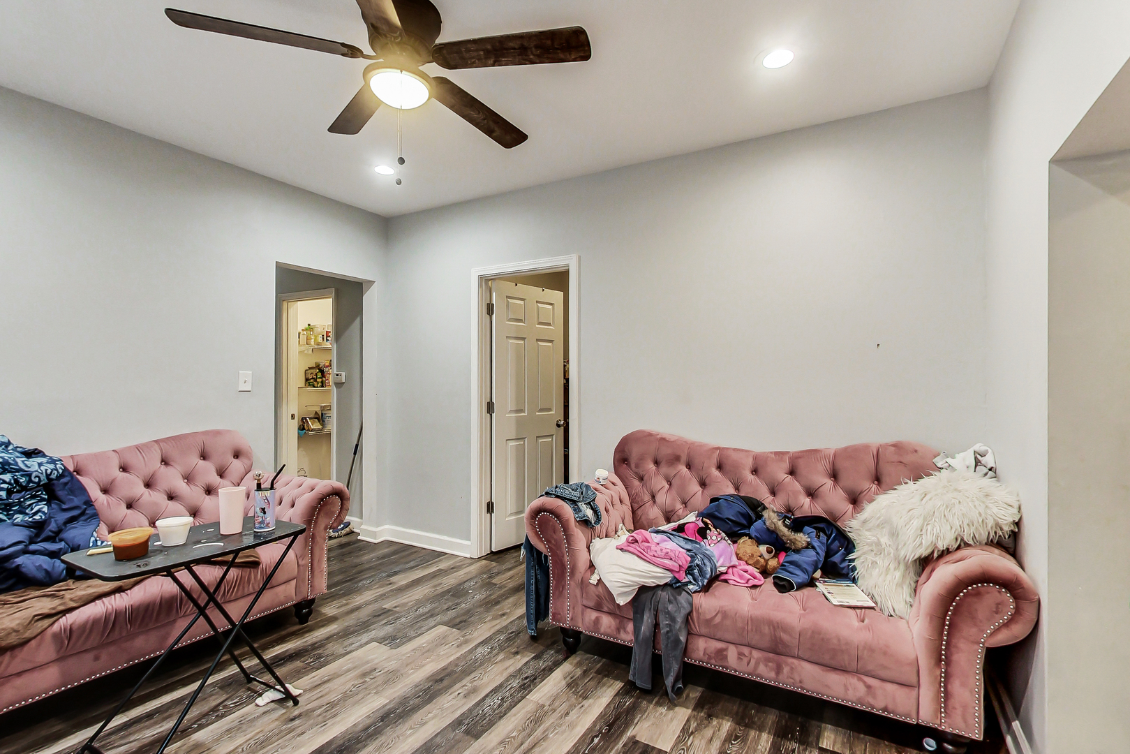 2338 West 18th Place Chicago, IL 60608 - Photo 18 of 63 a living room with furniture and a chandelier