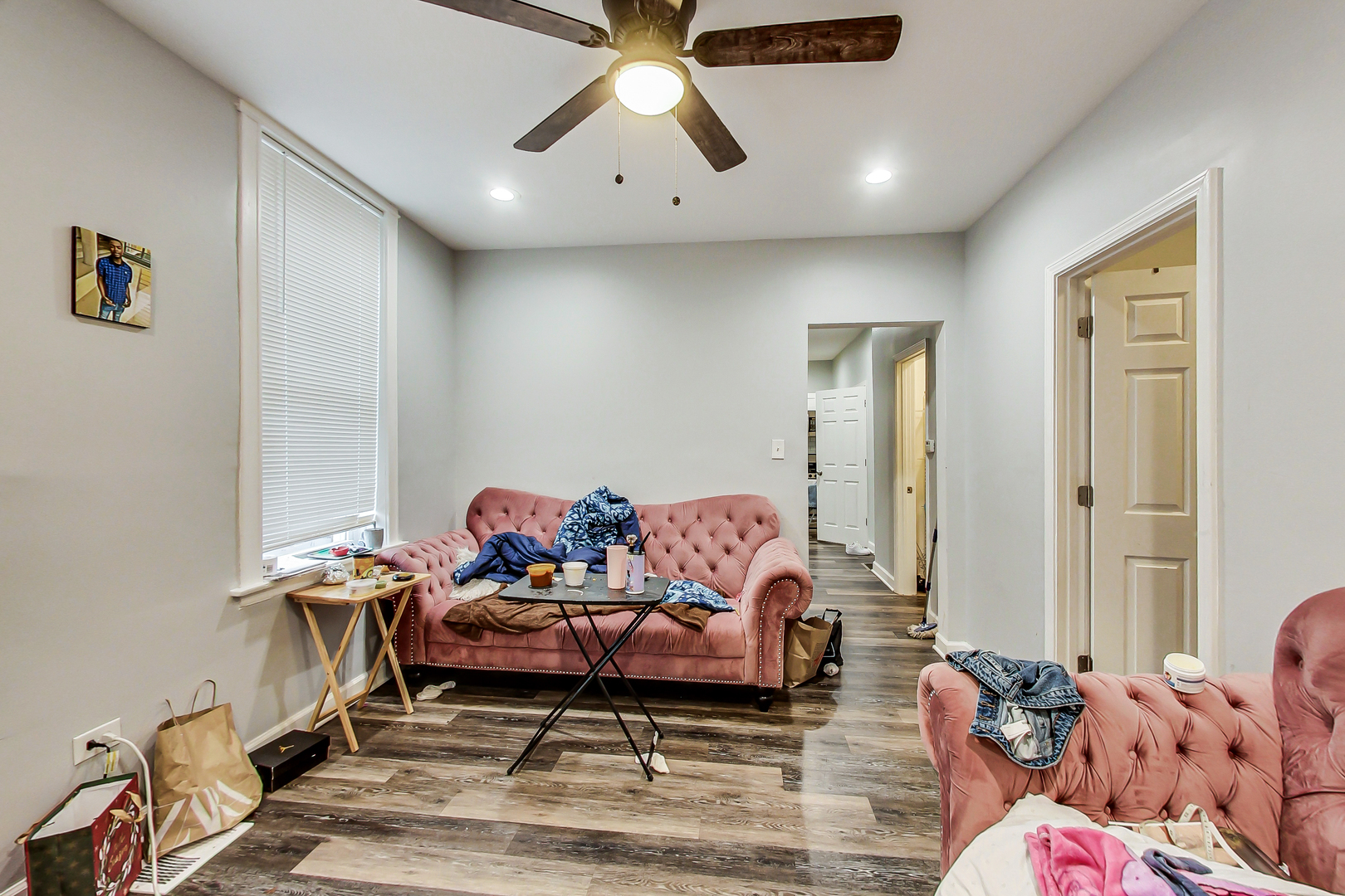2338 West 18th Place Chicago, IL 60608 - Photo 19 of 63 a living room with furniture and a chandelier