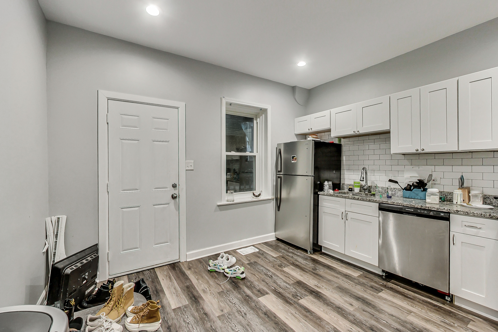 2338 West 18th Place Chicago, IL 60608 - Photo 22 of 63 a kitchen with granite countertop a refrigerator stove top oven and sink