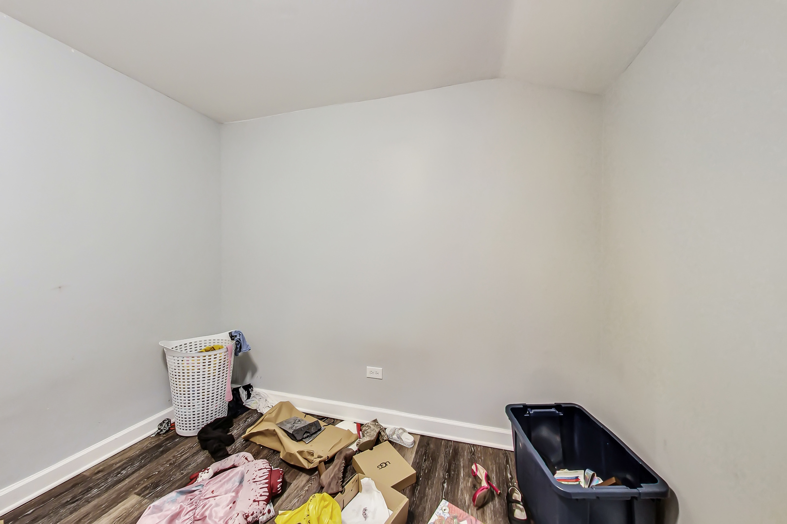 2338 West 18th Place Chicago, IL 60608 - Photo 27 of 63 a room with a wooden floor and shoes