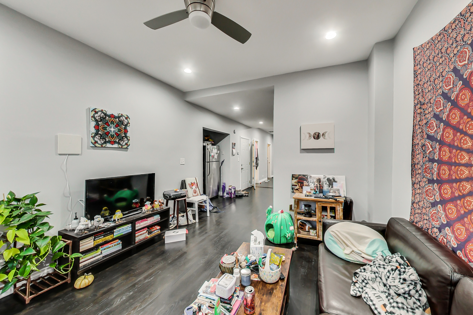 2338 West 18th Place Chicago, IL 60608 - Photo 38 of 63 a living room with furniture and a flat screen tv
