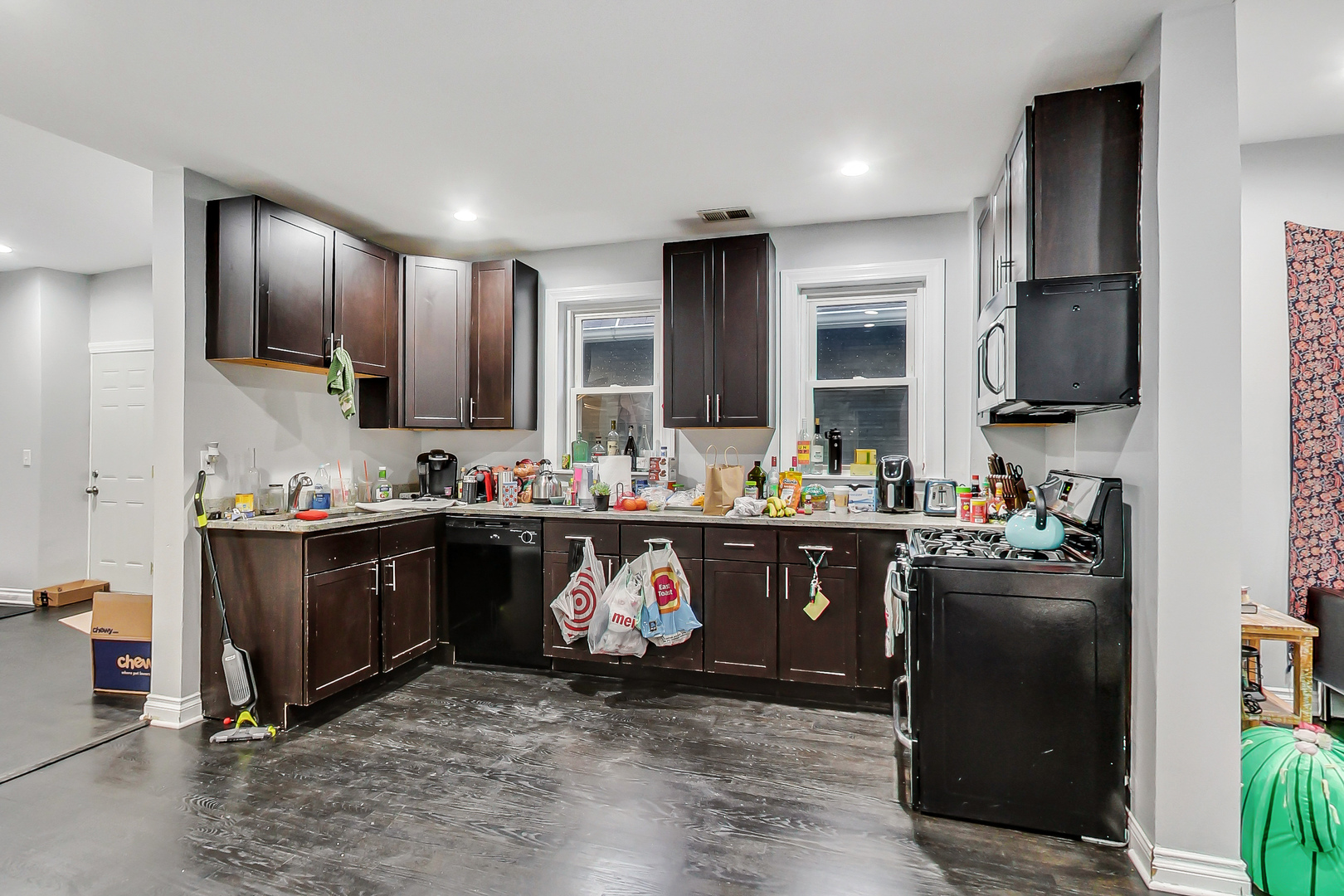 2338 West 18th Place Chicago, IL 60608 - Photo 39 of 63 a kitchen with stainless steel appliances granite countertop a sink stove and refrigerator
