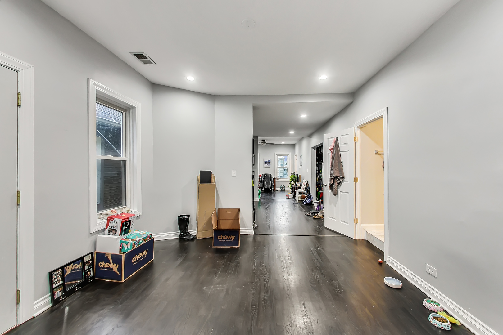2338 West 18th Place Chicago, IL 60608 - Photo 44 of 63 a living room with furniture and a wooden floor