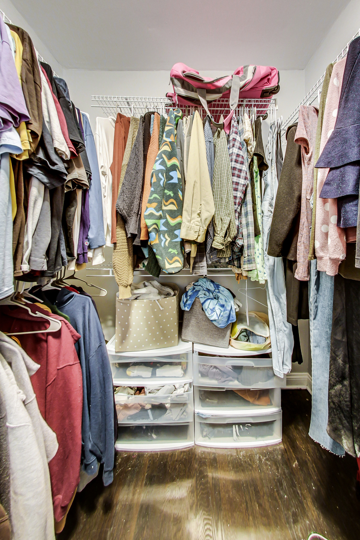 2338 West 18th Place Chicago, IL 60608 - Photo 48 of 63 a view of walk in closet with clothes and shoes