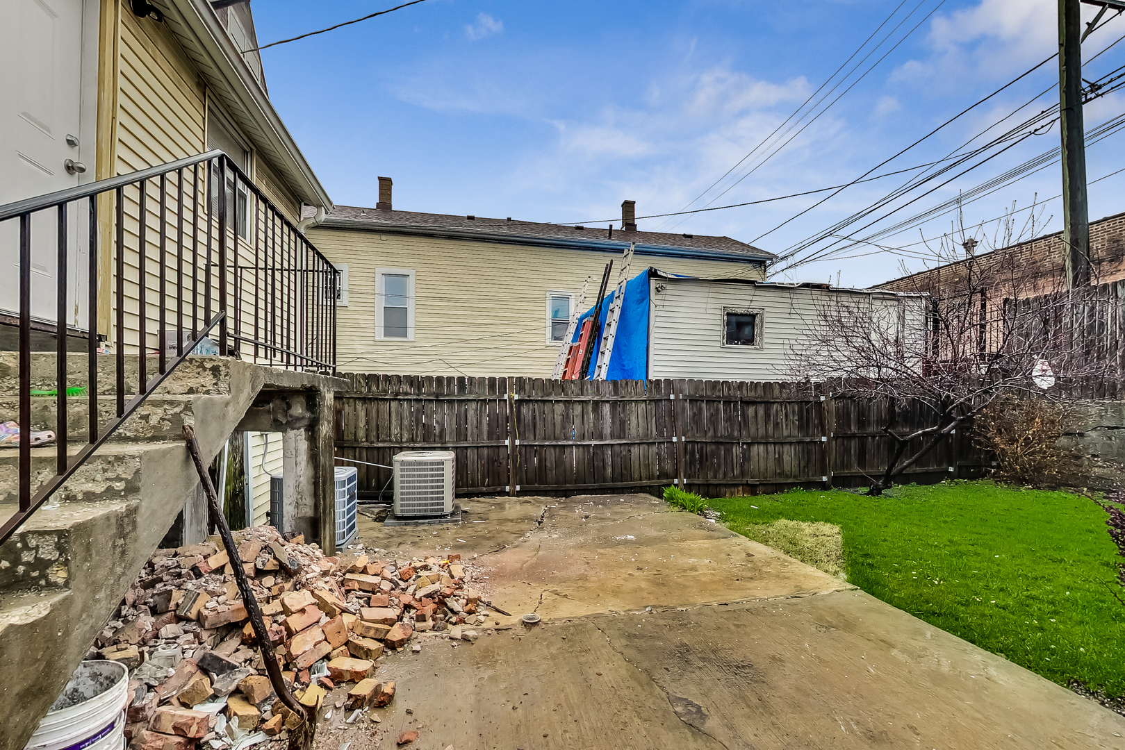 2338 West 18th Place Chicago, IL 60608 - Photo 57 of 63 a view of a small house with wooden fence