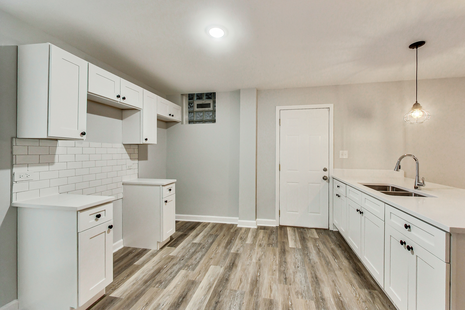 2338 West 18th Place Chicago, IL 60608 - Photo 8 of 63 a spacious bathroom with a double vanity sink a mirror and a shower