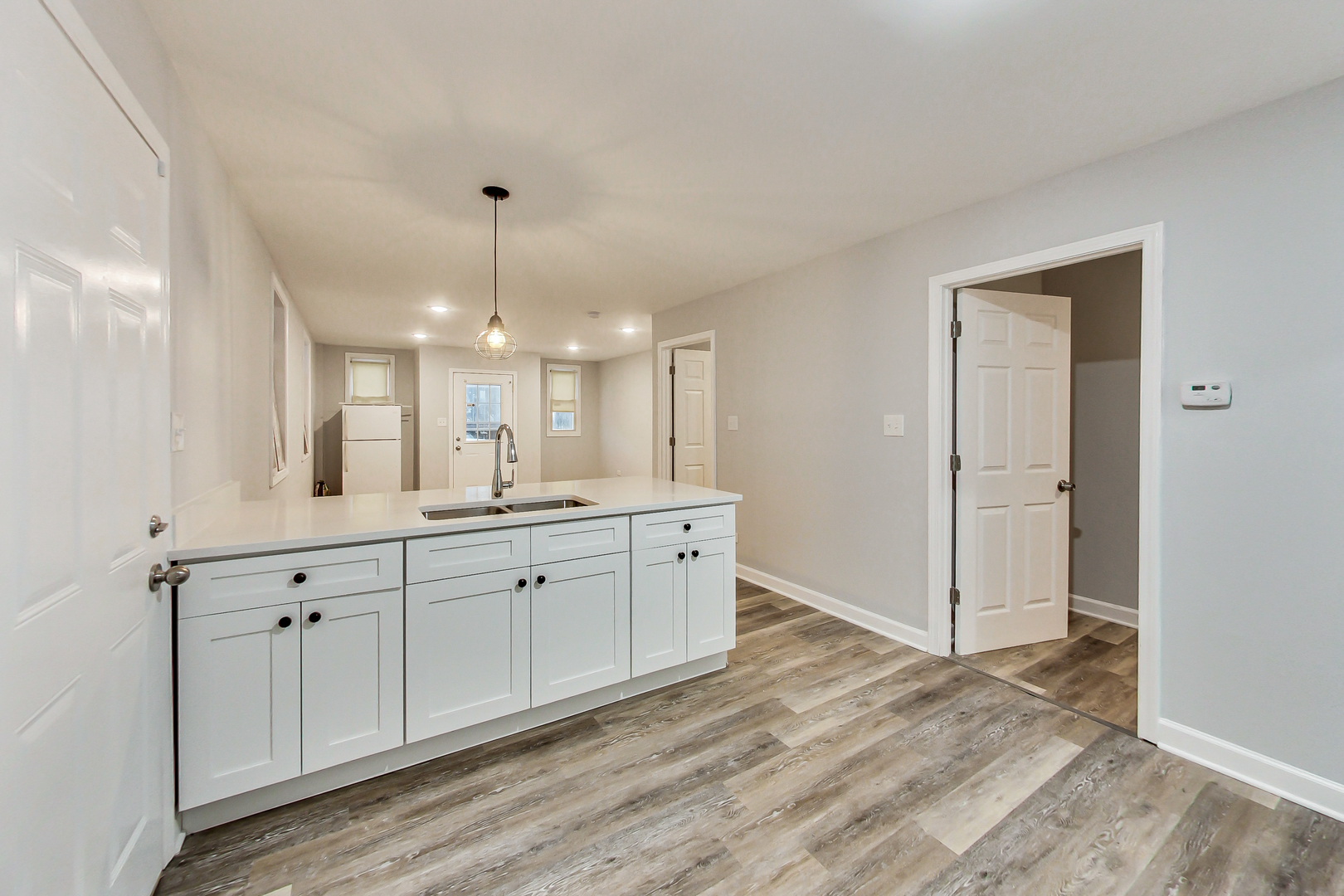 2338 West 18th Place Chicago, IL 60608 - Photo 9 of 63 a spacious bathroom with a double vanity sink and a mirror