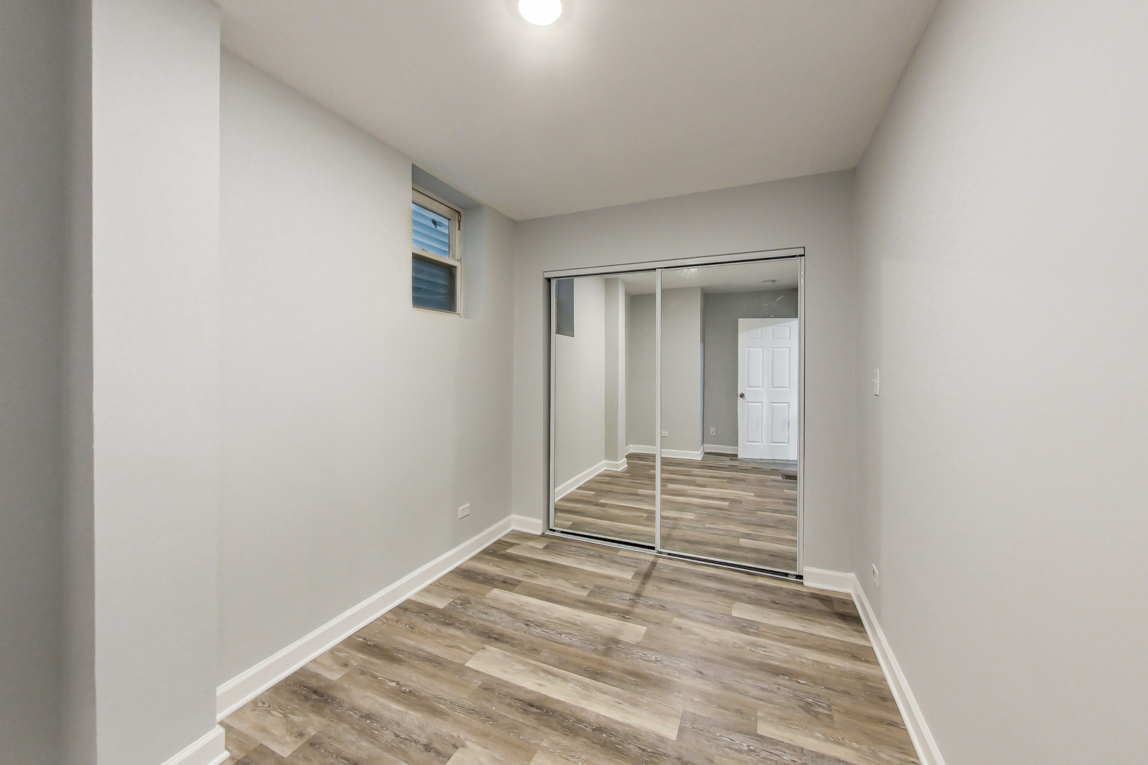 2338 West 18th Place Chicago, IL 60608 - Photo 10 of 63 a view of a closet area with wooden floor
