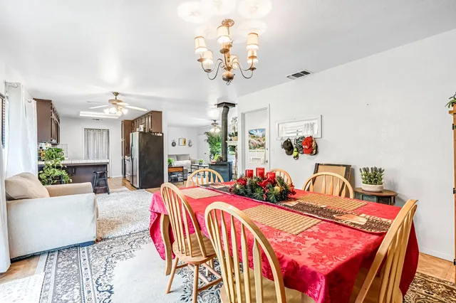 a living room with a bed and a chandelier