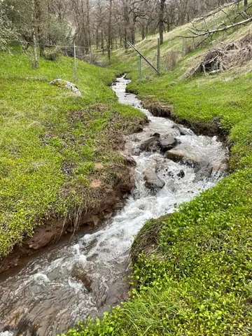 a view of a big yard with green space