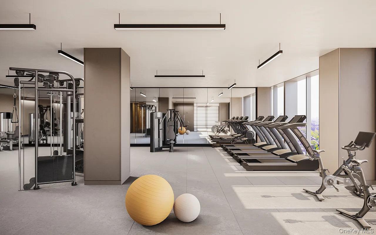 131-02 40th Road, Unit 9H Queens, NY 11354 - Photo 15 of 25 a view of a room with gym equipment