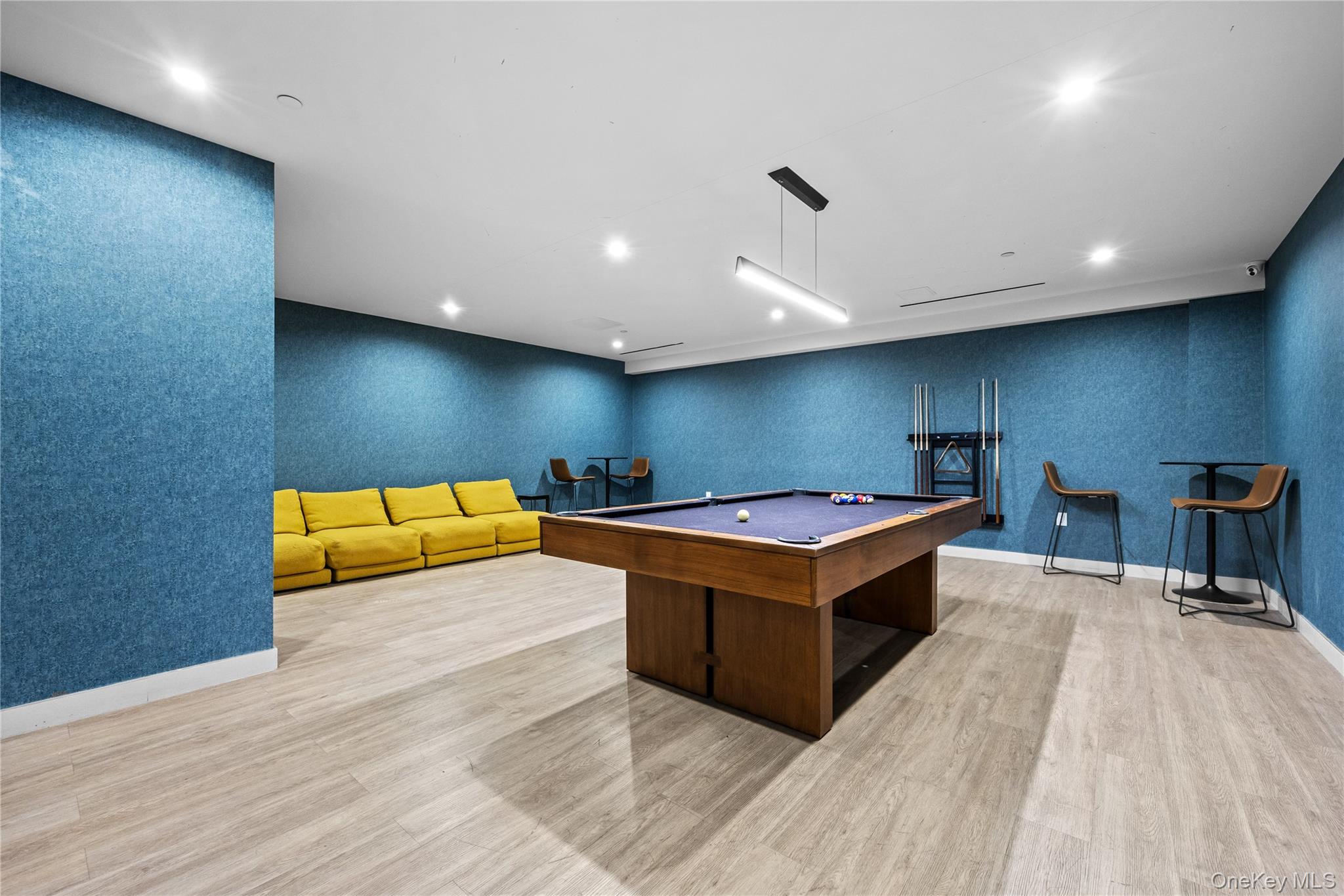 131-02 40th Road, Unit 9H Queens, NY 11354 - Photo 19 of 25 a living room with a couch and a table