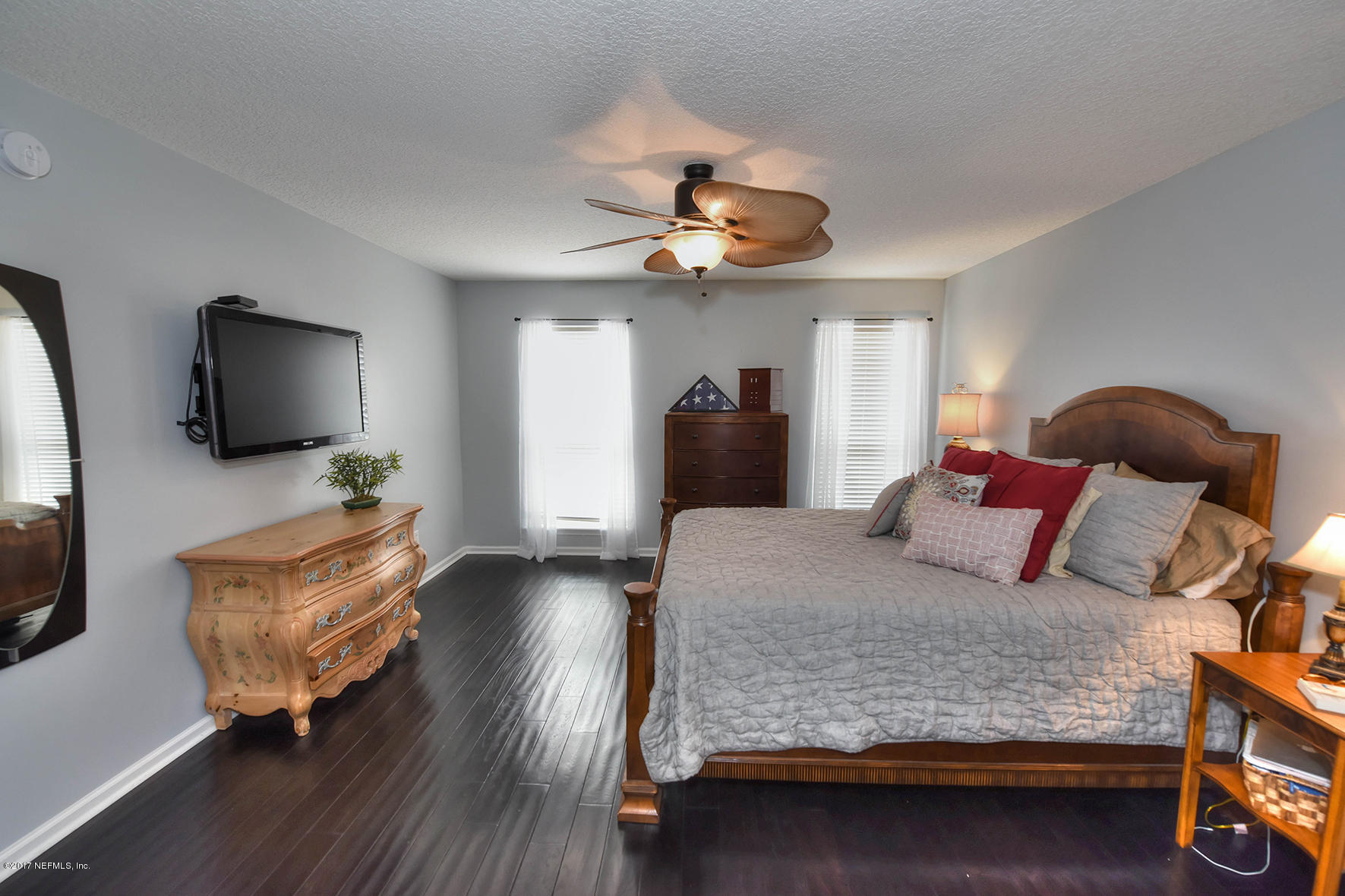 1241 Ribbon Road St. Johns, FL 32259 - Photo 27 of 64 a bedroom with a bed and wooden floor
