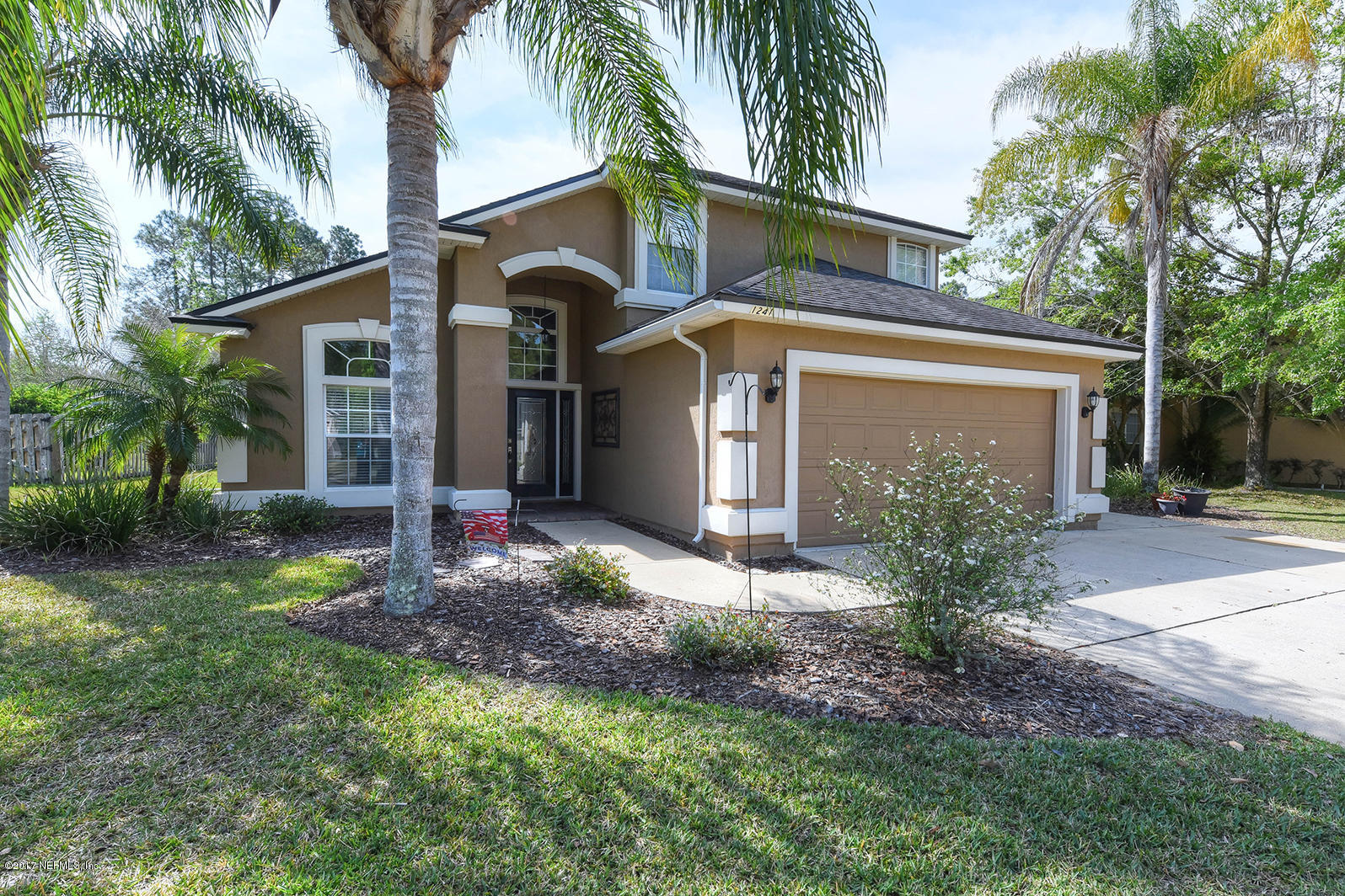 1241 Ribbon Road St. Johns, FL 32259 - Photo 3 of 64 a front view of a house with garden