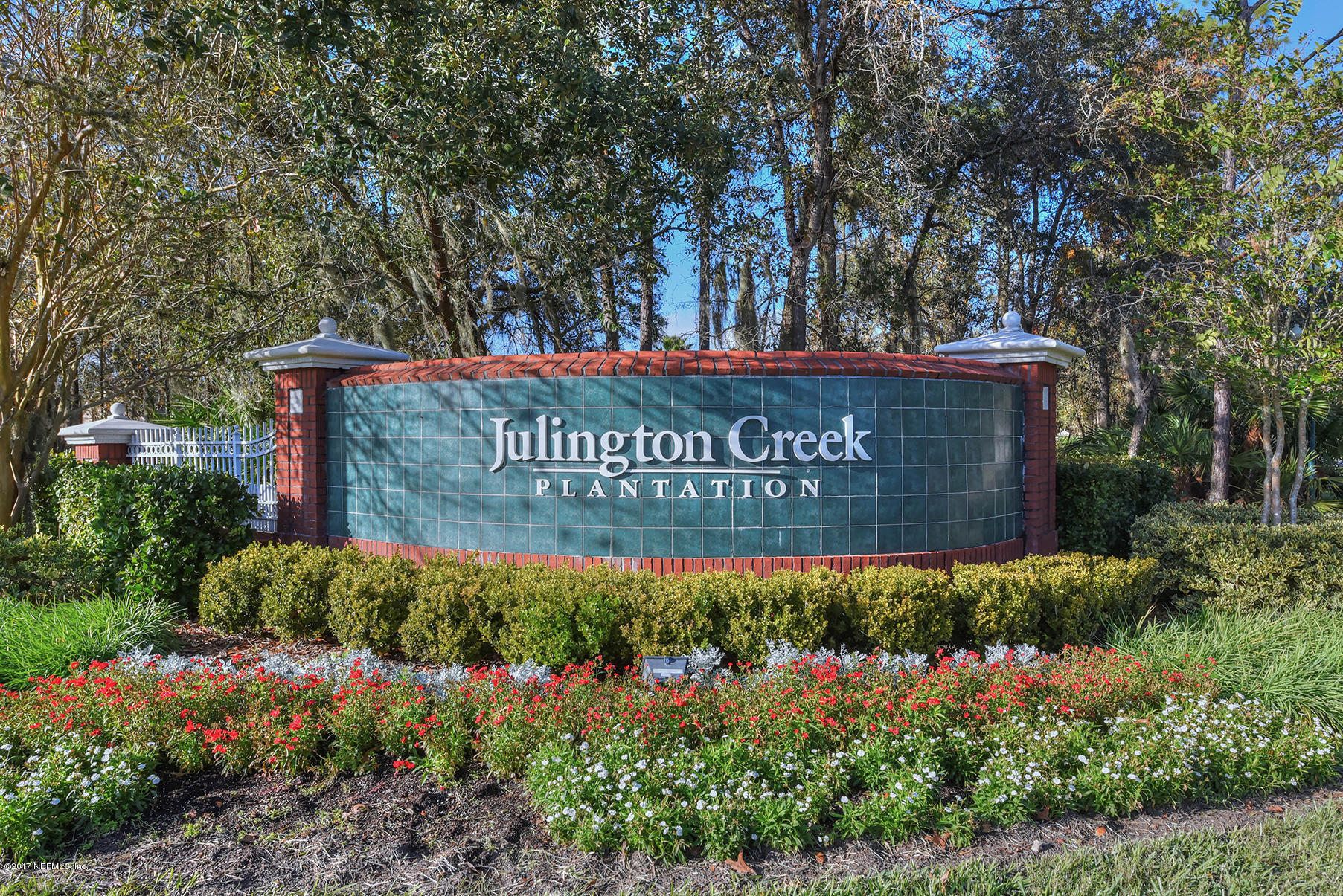 1241 Ribbon Road St. Johns, FL 32259 - Photo 53 of 64 a view of front of house with sign board and garden