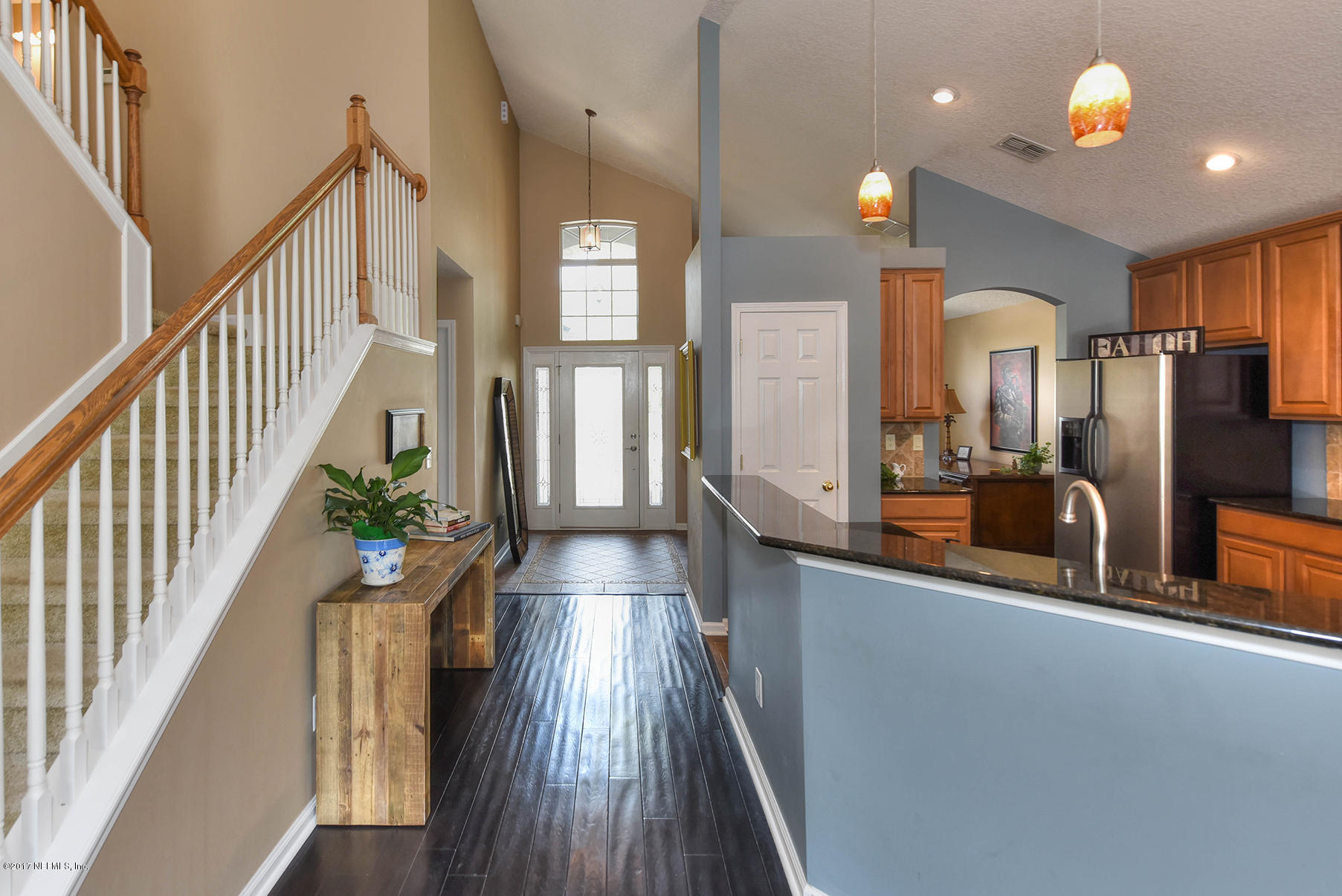 1241 Ribbon Road St. Johns, FL 32259 - Photo 8 of 64 a view of a hallway with wooden floor and staircase