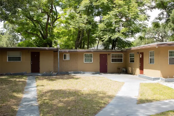 a view of a backyard of the house