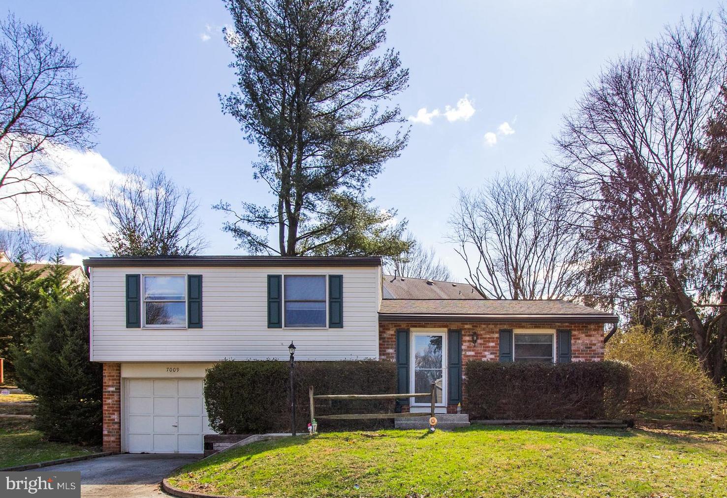 a view of a house with swimming pool and porch