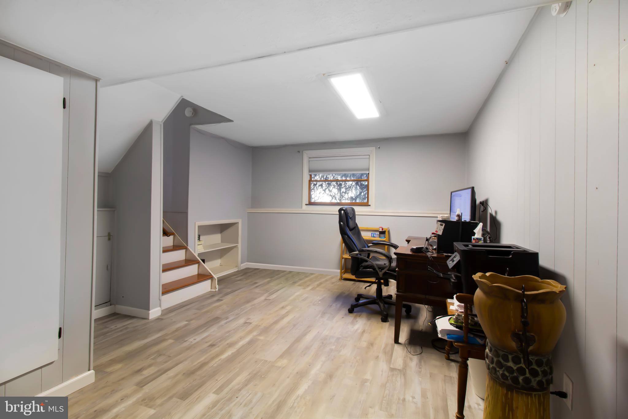 7009 Deepage Drive Columbia, MD 21045 - Photo 14 of 34 a living room with furniture and a wooden floor