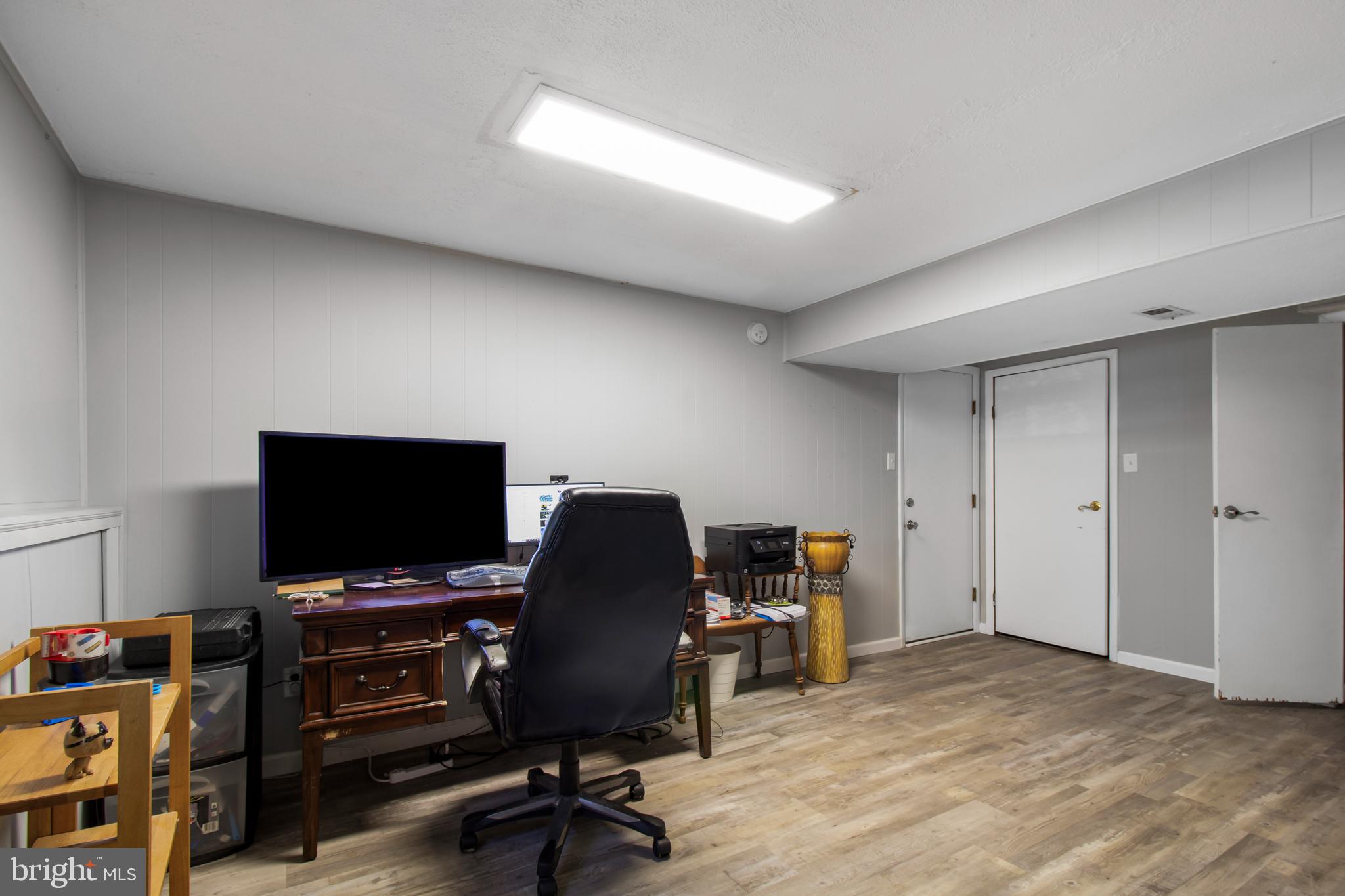 7009 Deepage Drive Columbia, MD 21045 - Photo 15 of 34 a view of a workspace with furniture and a window