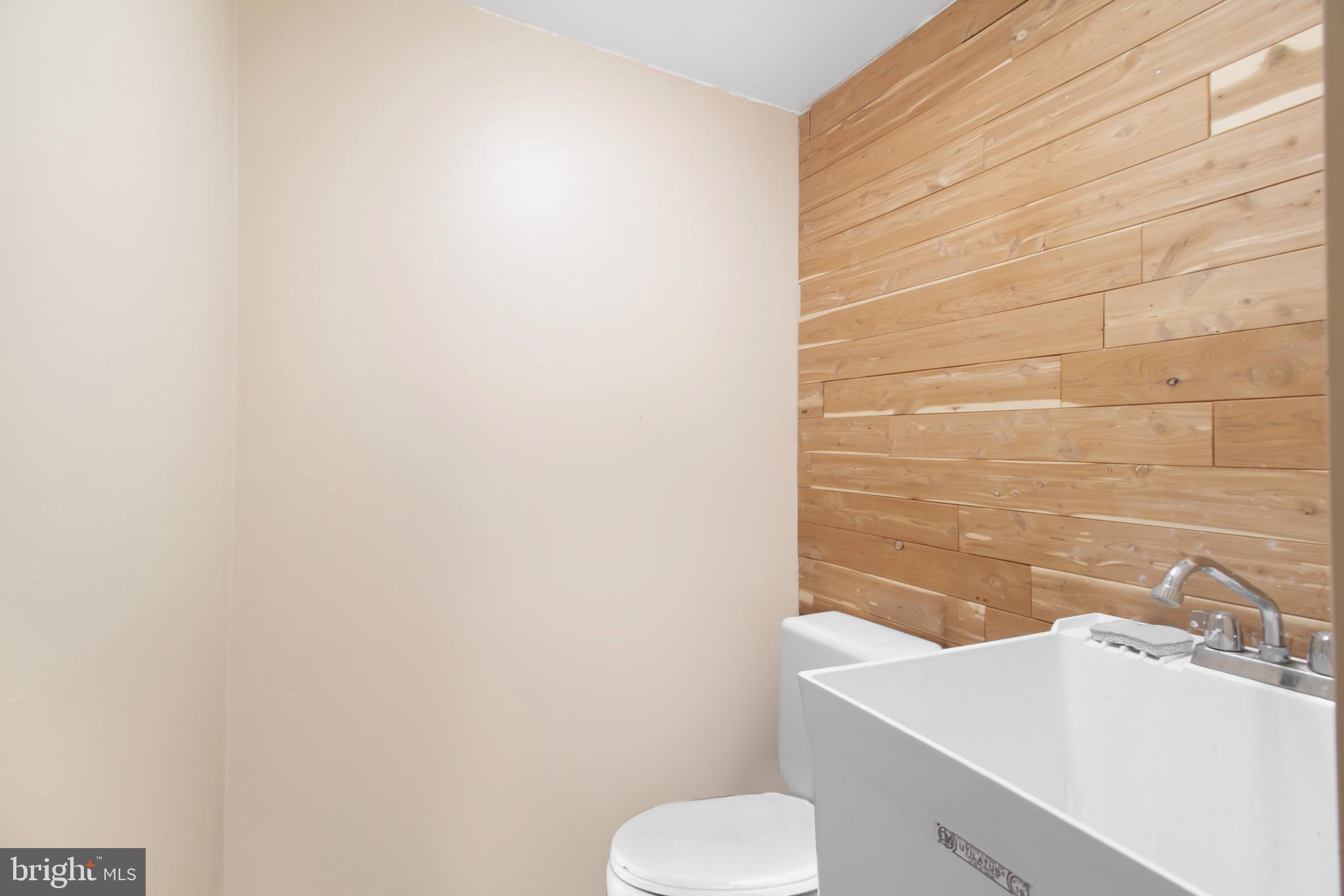 7009 Deepage Drive Columbia, MD 21045 - Photo 16 of 34 a bathroom with a sink toilet and mirror