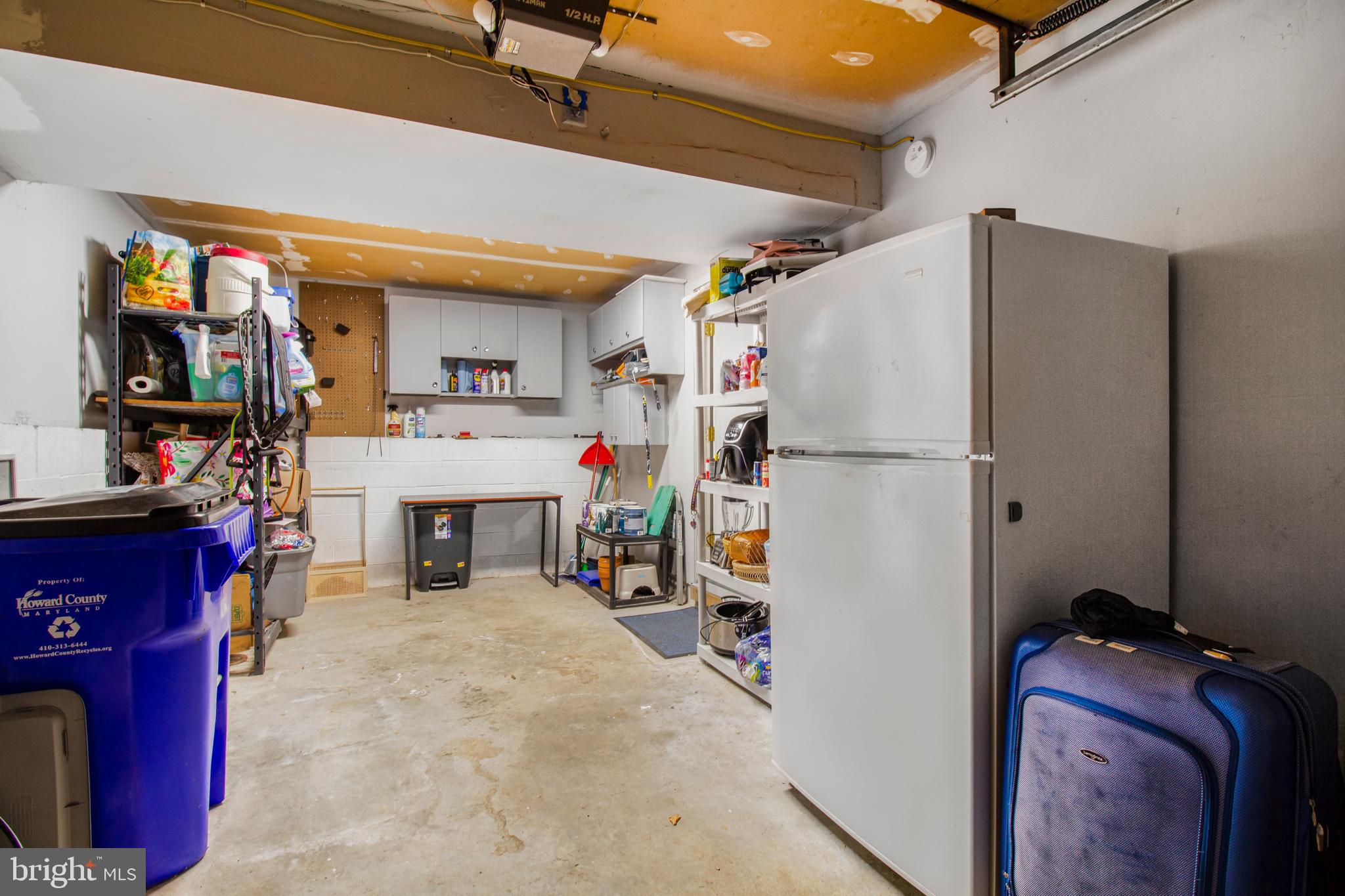 7009 Deepage Drive Columbia, MD 21045 - Photo 19 of 34 a storage room with closet dryer and washer