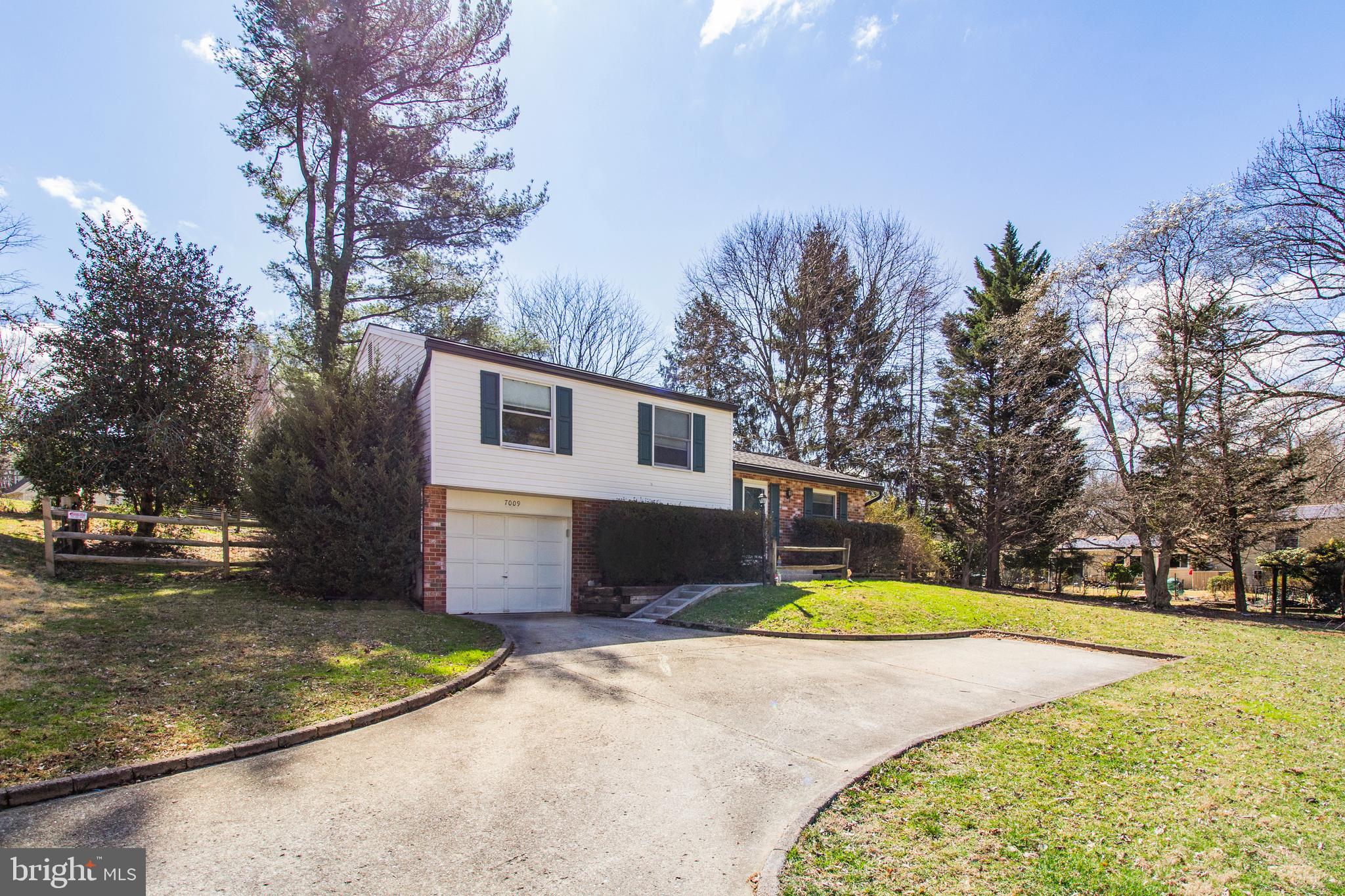 7009 Deepage Drive Columbia, MD 21045 - Photo 2 of 34 a view of a house with swimming pool and a yard