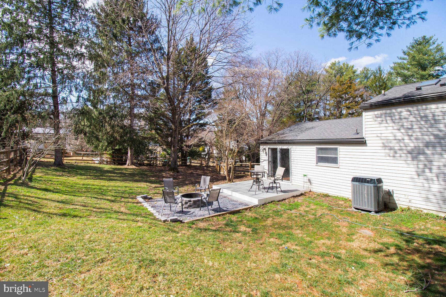 7009 Deepage Drive Columbia, MD 21045 - Photo 22 of 34 a view of a house with backyard and sitting area