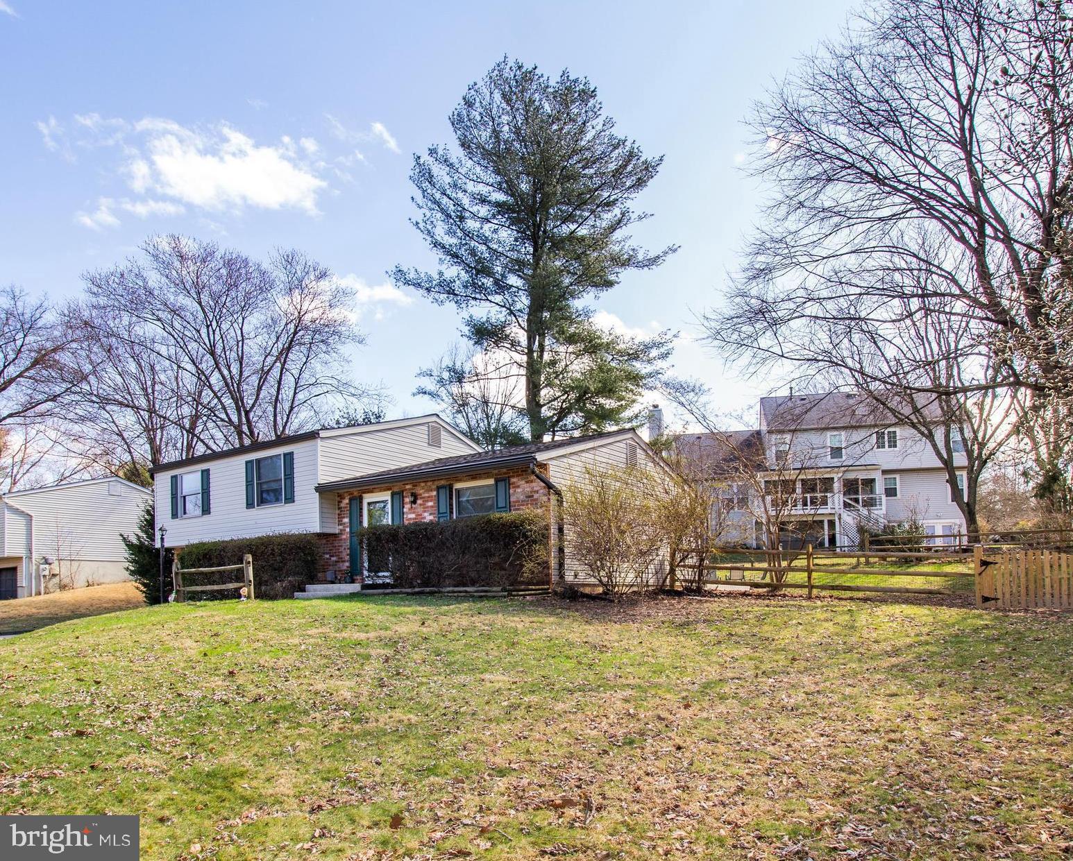 7009 Deepage Drive Columbia, MD 21045 - Photo 25 of 34 a view of a house with a yard covered with snow