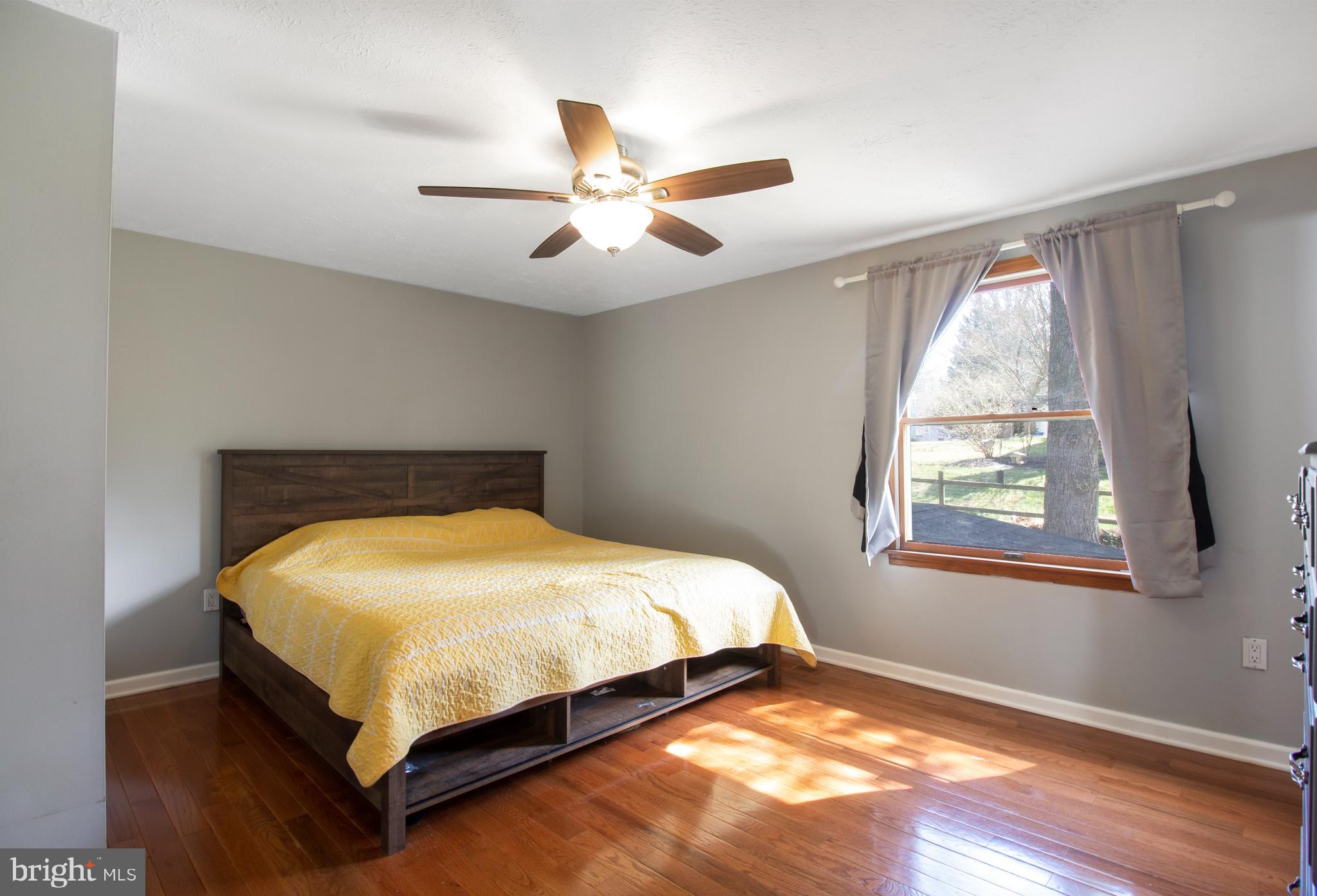 7009 Deepage Drive Columbia, MD 21045 - Photo 8 of 34 a bedroom with a bed and window