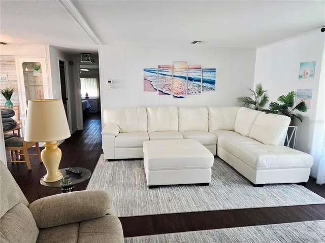 a bedroom with a bed and flat screen tv