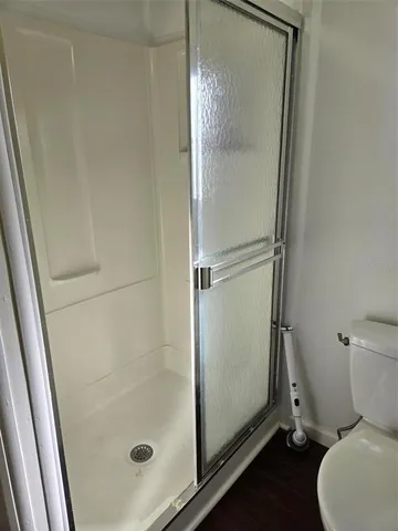 a bedroom with double bed and a window